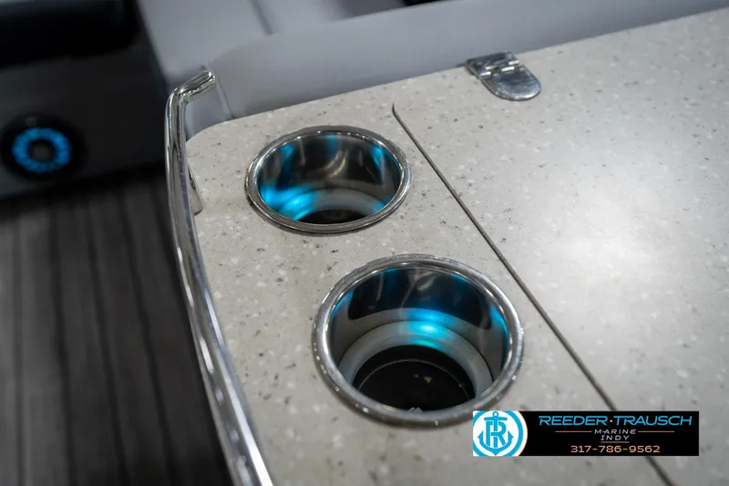 Slide: The Image of Speaker on a 2020 Harris Solstice boat, featuring Reeder-Trausch Marine branding. - 46