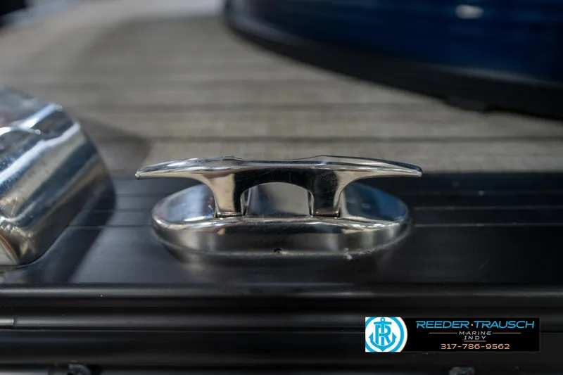 Slide: The Image of Close-up of a 2020 Harris Solstice boat detail with Reeder Trausch Marine logo. - 58