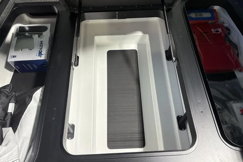 Slide: The Image of Storage compartment of 2026 Skeeter ZXR20 SE boat with accessories and equipment. - 12