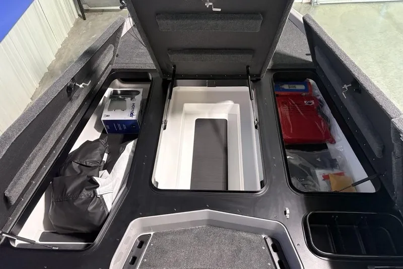 Slide: The Image of 2026 Skeeter ZXR20 SE boat storage compartments with organized gear and equipment. - 13