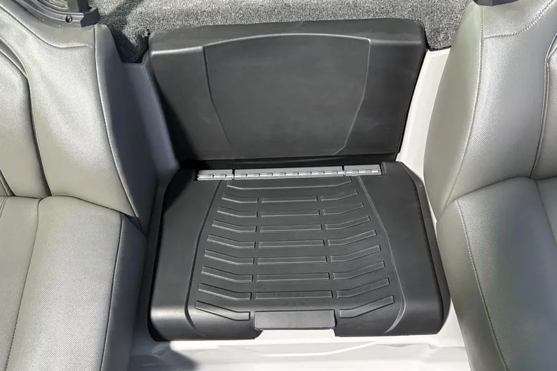 Slide: The Image of 2026 Skeeter ZXR20 SE boat interior with gray seating and black storage compartment. - 16