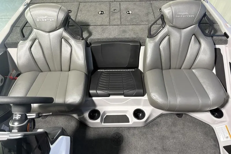 Slide: The Image of 2026 Skeeter ZXR20 SE boat interior with two gray seats and console. - 19