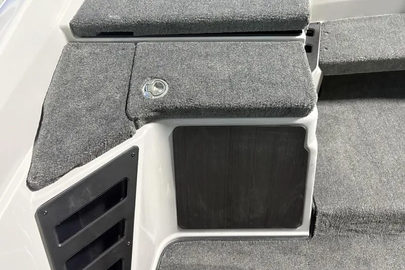 Slide: The Image of Interior view of 2026 Skeeter ZXR20 SE boat with carpeted steps and storage. - 20