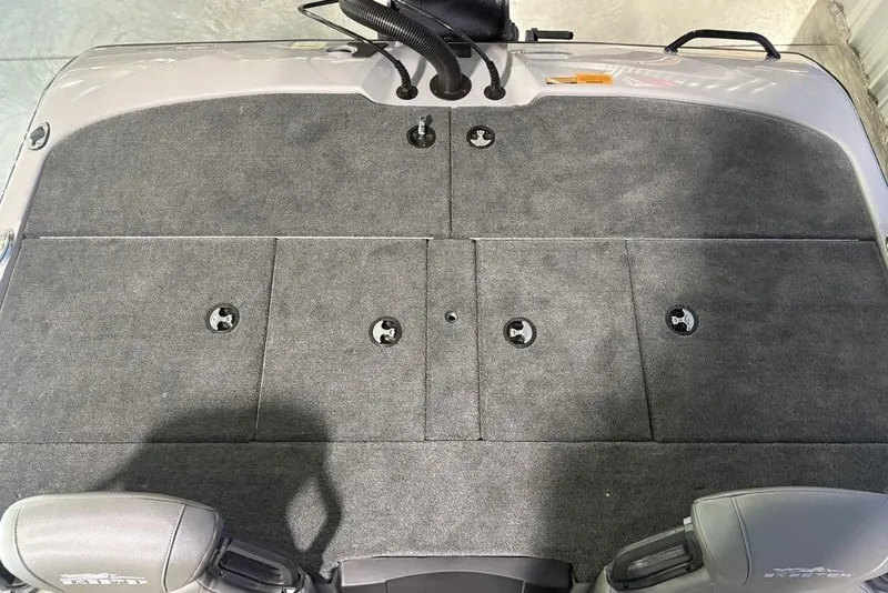 Slide: The Image of 2026 Skeeter ZXR20 SE boat deck with gray carpet and storage compartments. - 22