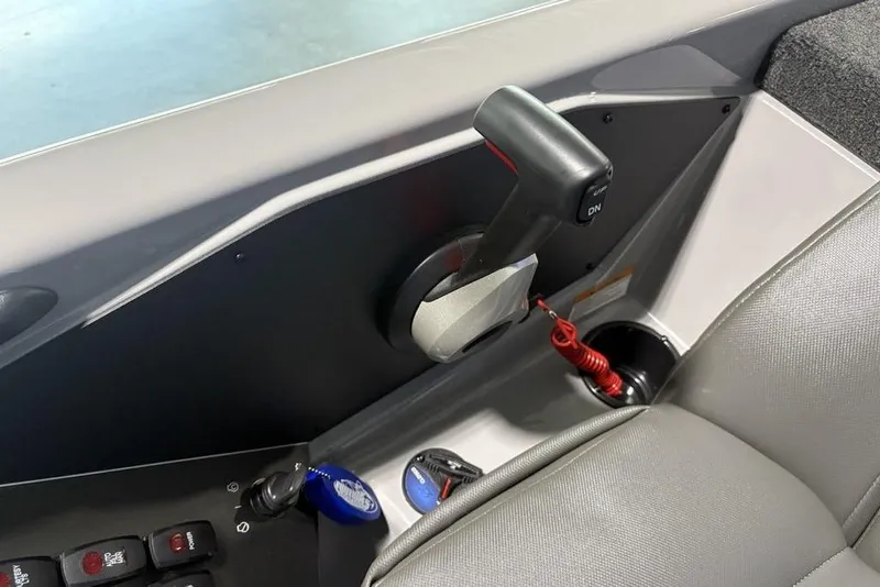 Slide: The Image of Control panel of 2026 Skeeter ZXR20 SE boat with throttle and switches. - 26