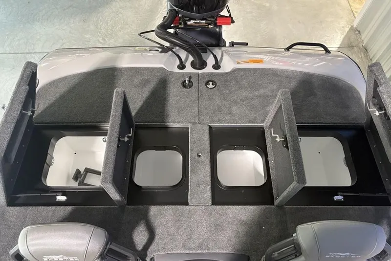 Slide: The Image of 2026 Skeeter ZXR20 SE boat storage compartments with open hatches, showcasing interior space. - 32