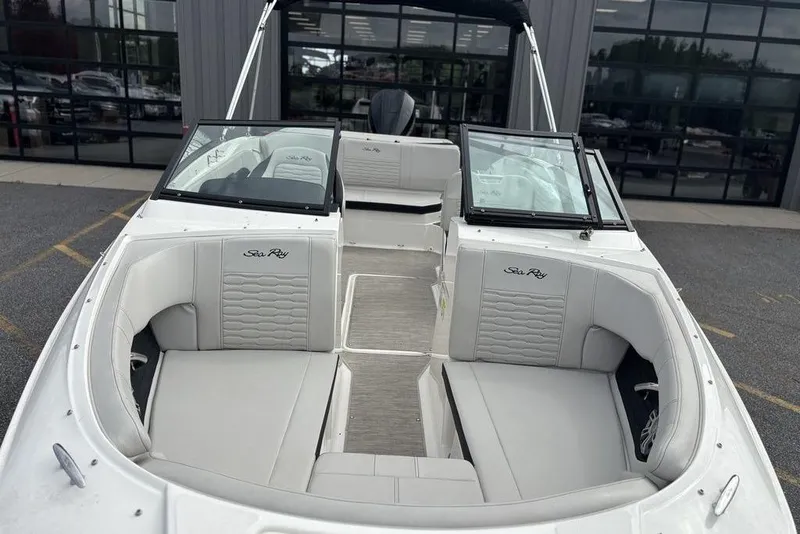 Slide: The Image of 2023 Sea Ray SPX 210 Outboard boat with spacious seating and sleek design. - 11