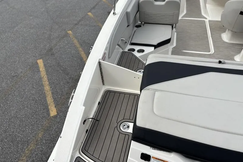 Slide: The Image of 2023 Sea Ray SPX 210 Outboard boat interior with seating and deck details. - 13