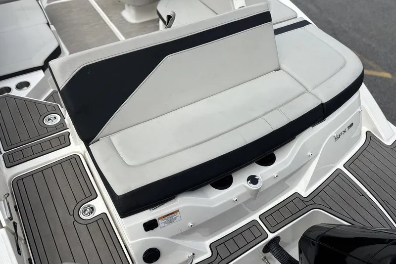 Slide: The Image of 2023 Sea Ray SPX 210 Outboard boat seating and deck detail. - 17