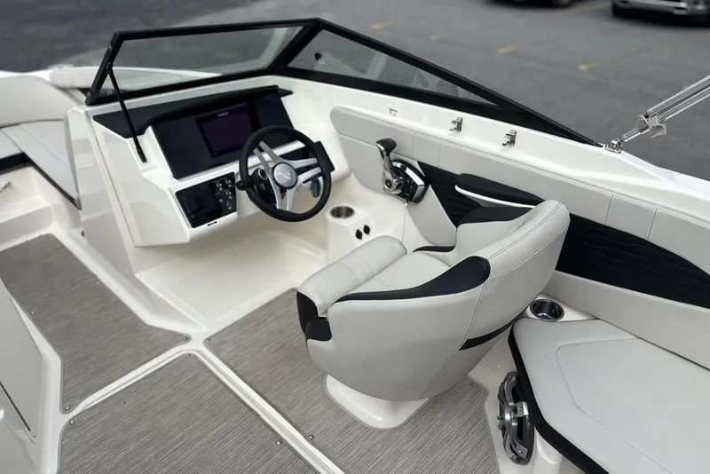Slide: The Image of 2023 Sea Ray SPX 210 Outboard boat interior with modern helm and seating. - 19