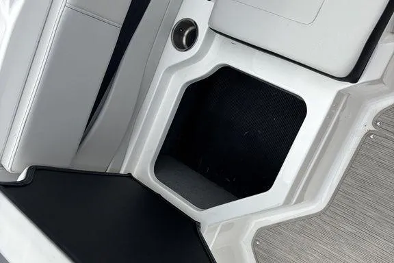 Slide: The Image of 2023 Sea Ray SPX 210 Outboard interior storage compartment detail. - 20