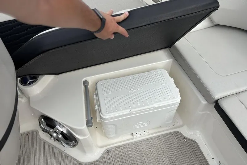 Slide: The Image of 2023 Sea Ray SPX 210 Outboard boat storage with cooler and seating. - 25