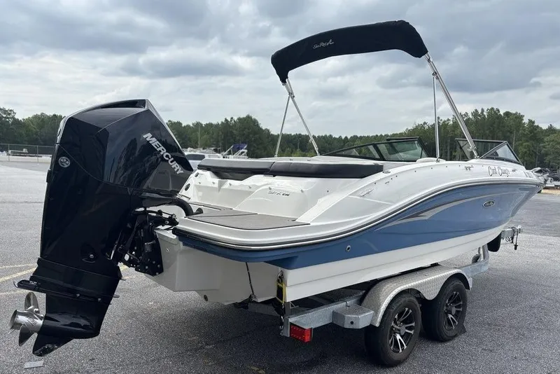 Slide: The Image of 2023 Sea Ray SPX 210 Outboard boat on trailer, featuring a Mercury engine. - 6