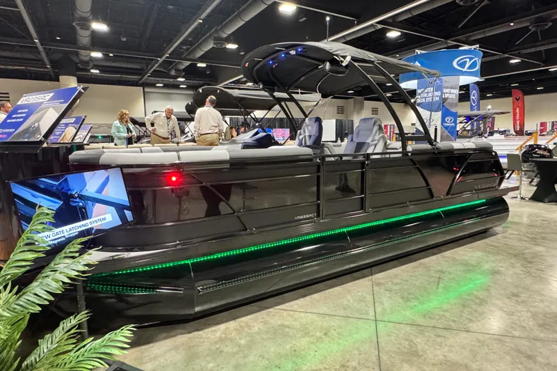Slide: The Image of 2026 Veranda Relax VR235RC pontoon boat displayed at an indoor exhibition. - 1
