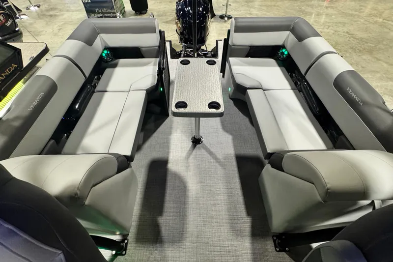 Slide: The Image of 2026 Veranda Relax VR235RC pontoon boat interior with gray seating and central table. - 12