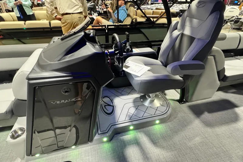 Slide: The Image of 2026 Veranda Relax VR235RC boat interior with modern helm and comfortable captain's chair. - 7