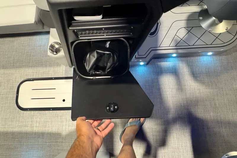 Slide: The Image of 2026 Veranda Relax VR235RC boat interior with storage compartment and blue LED lighting. - 8