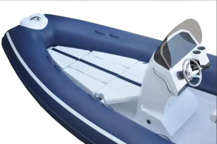 Slide: The Image of AB Inflatables Oceanus 21 VST 2026, blue and white design, visible steering console. - 8