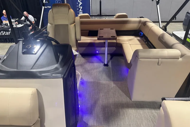Slide: The Image of 2026 Veranda Relax VR235F2 pontoon boat interior with beige seating and blue LED lighting. - 4