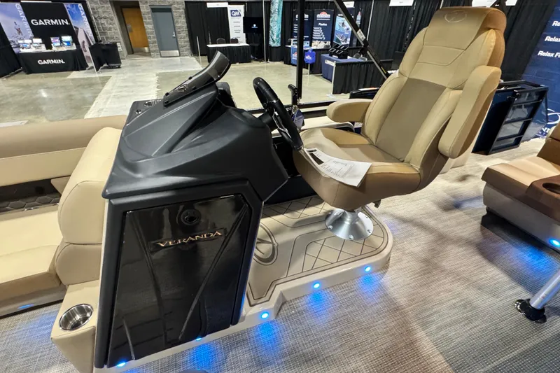 Slide: The Image of 2026 Veranda Relax VR235F2 boat interior with captain's chair and control console. - 5