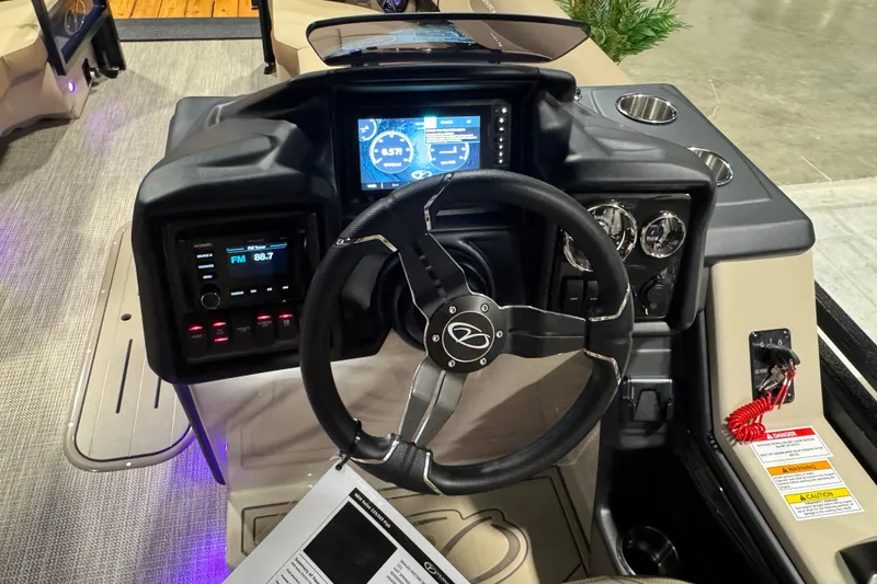 Slide: The Image of 2026 Veranda Relax VR235F2 boat dashboard with steering wheel and digital display. - 6