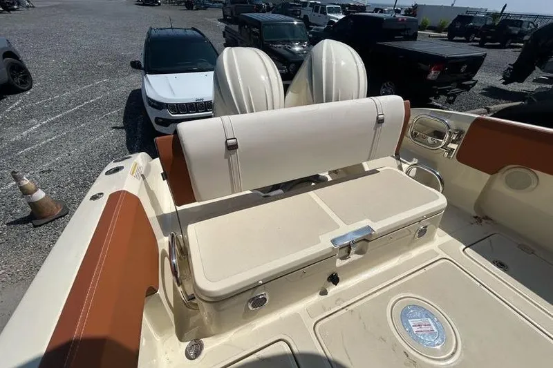 Slide: The Image of 2024 Capoforte FX270 boat interior with seating and storage compartments. - 11