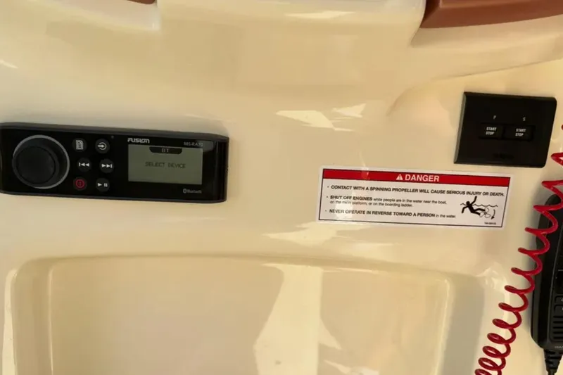 Slide: The Image of 2024 Capoforte FX270 dashboard with Fusion stereo, safety warning, and control panel. - 21