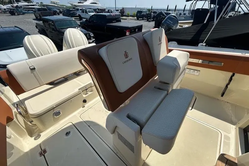 Slide: The Image of 2024 Capoforte FX270 boat interior with luxurious seating and elegant design. - 8