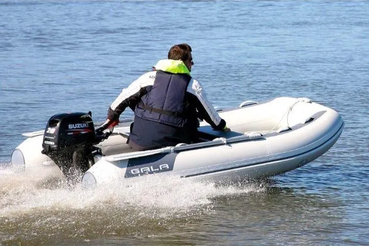 Slide: The Image of Man driving 2025 Gala A270D inflatable boat with Suzuki motor. - 8