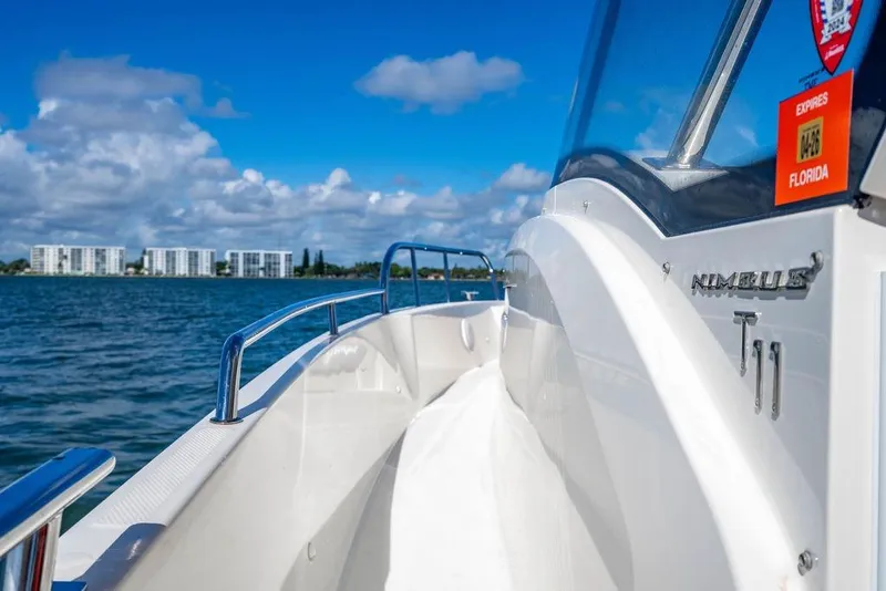 Slide: The Image of 2023 Nimbus Tender 11 boat cruising on a sunny day near Florida coastline. - 17