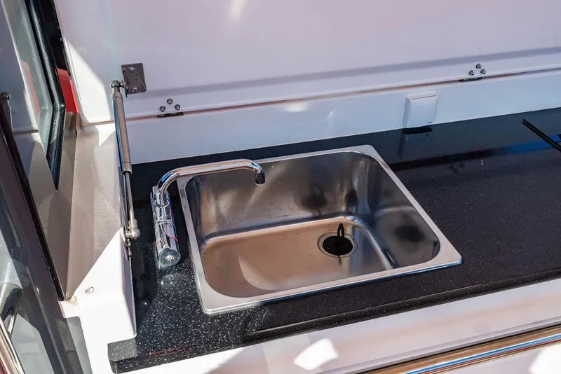 Slide: The Image of Stainless steel sink in 2023 Nimbus Tender 11 boat kitchen area. - 19