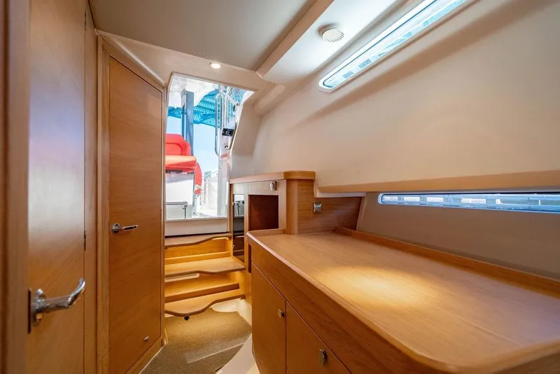 Slide: The Image of Interior of 2023 Nimbus Tender 11, featuring wooden cabinetry and modern design. - 21
