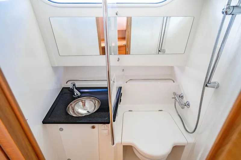Slide: The Image of 2023 Nimbus Tender 11 bathroom with sink, mirror, and shower. - 26