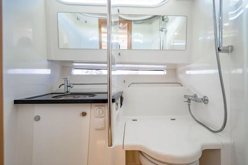 Slide: The Image of 2023 Nimbus Tender 11 bathroom with modern sink, mirror, and shower. - 27