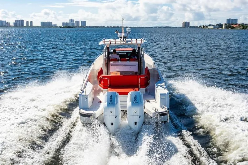 Slide: The Image of 2023 Nimbus Tender 11 cruising on open water with twin engines. - 36