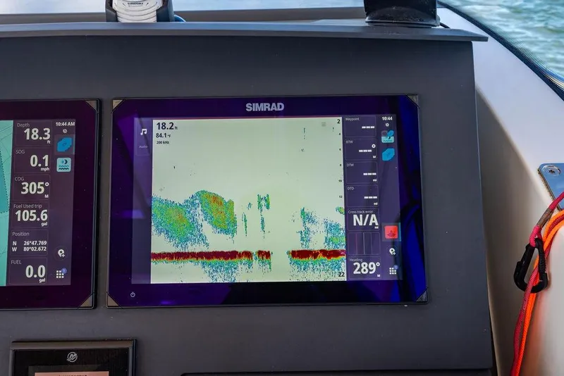 Slide: The Image of Simrad navigation display on 2023 Nimbus Tender 11 boat, showing depth and sonar data. - 6