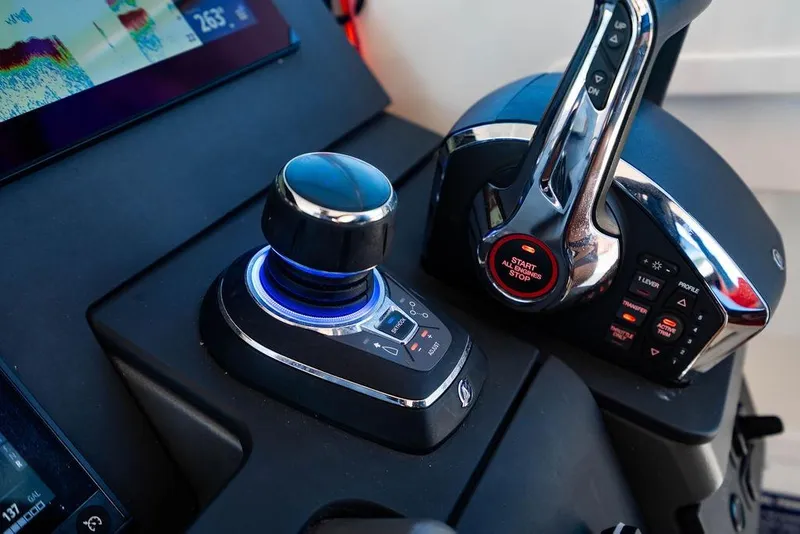 Slide: The Image of Control panel of 2023 Nimbus Tender 11 boat with joystick and throttle. - 8