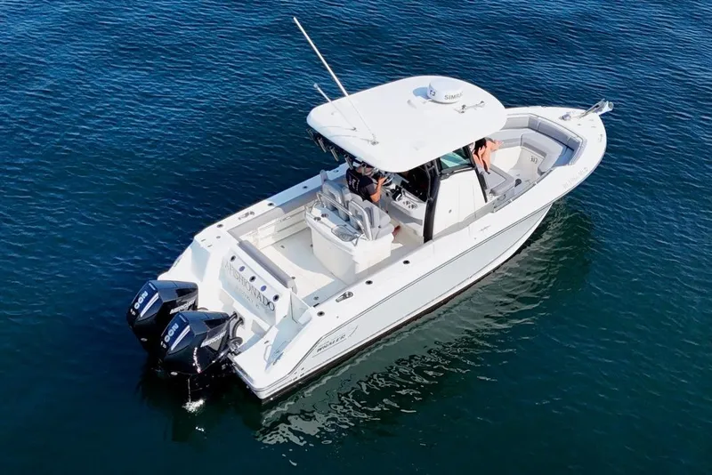 Slide: The Image of 2024 Boston Whaler 250 Outrage boat on calm blue water, aerial view. - 6