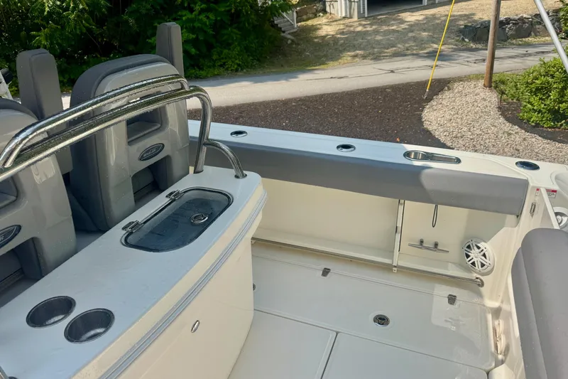 Slide: The Image of 2024 Boston Whaler 250 Outrage boat interior with seating and storage features. - 9