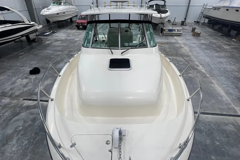 Slide: The Image of 2001 Pursuit 3070 Offshore boat in storage, viewed from the bow. - 14