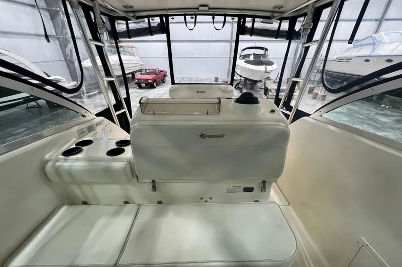Slide: The Image of Interior of a 2001 Pursuit 3070 Offshore boat in a storage facility. - 18