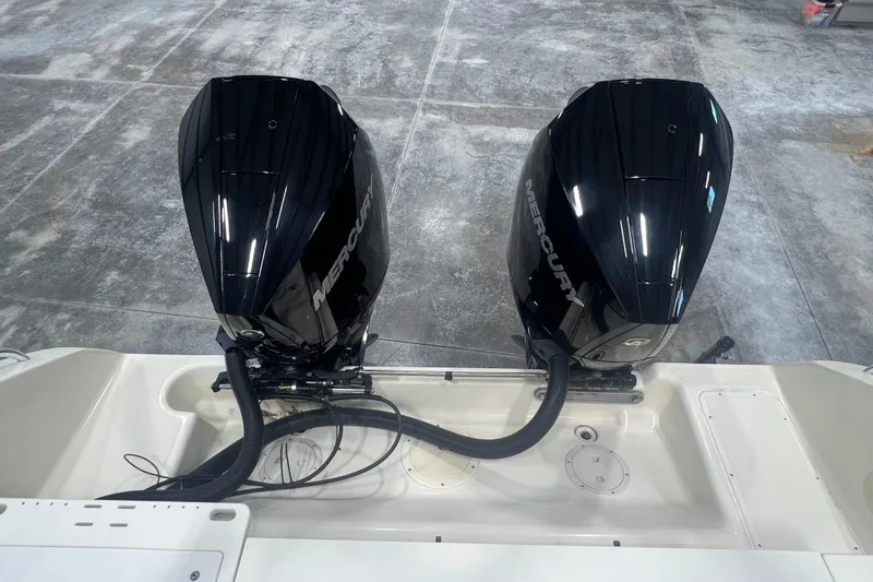 Slide: The Image of Twin Mercury outboard engines on a 2001 Pursuit 3070 Offshore boat. - 8