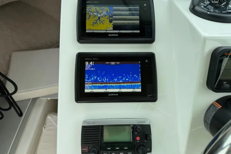 Slide: The Image of Garmin navigation and communication equipment on 2014 Parker 2120 Sport Cabin boat dashboard. - 3