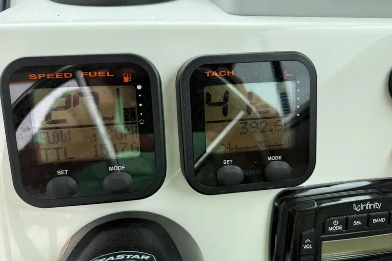 Slide: The Image of Dashboard of a 2014 Parker 2120 Sport Cabin boat showing speed and tachometer displays. - 5