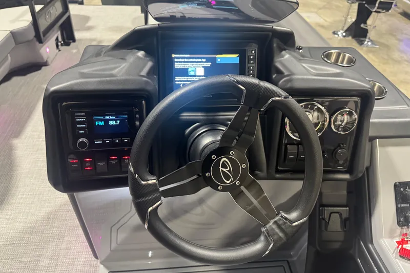 Slide: The Image of 2026 Veranda Relax VR265F2+2 boat dashboard with steering wheel and control panel. - 10