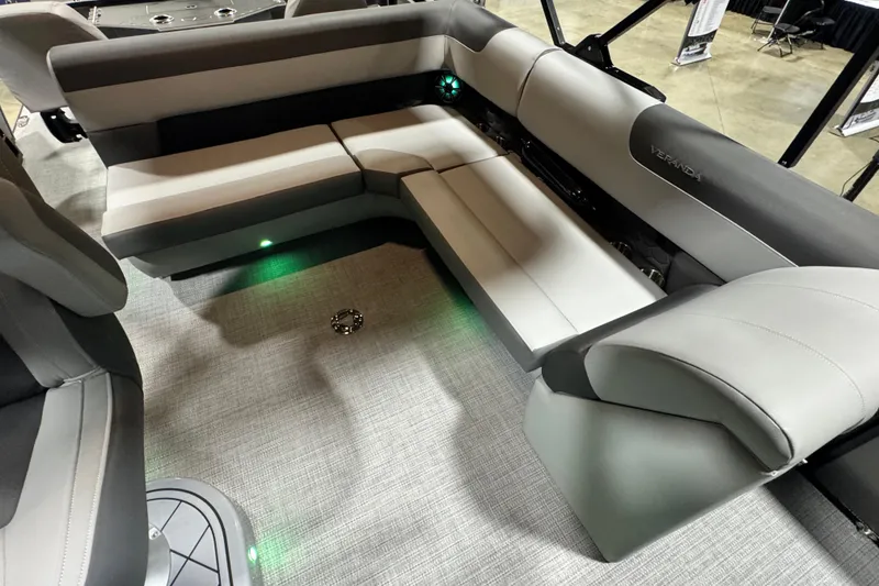 Slide: The Image of 2026 Veranda Relax VR265F2+2 boat interior with gray seating and ambient lighting. - 12