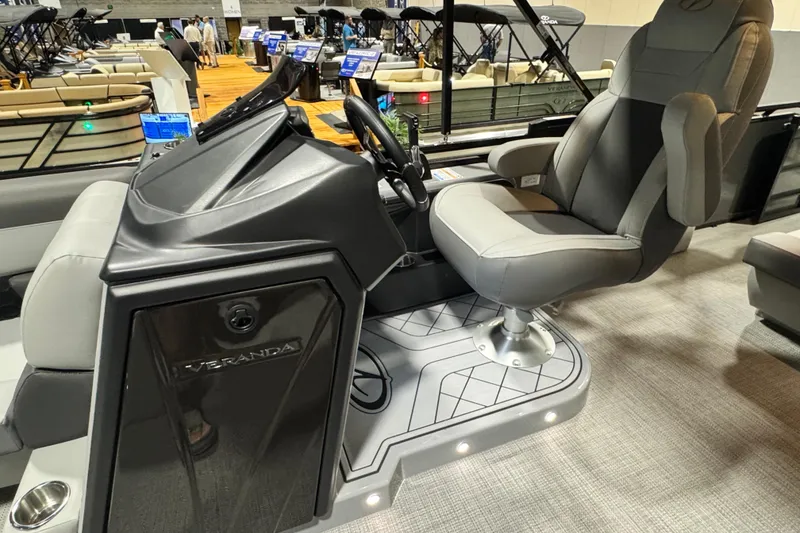 Slide: The Image of 2026 Veranda Relax VR265F2+2 boat interior with captain's chair and control console. - 9