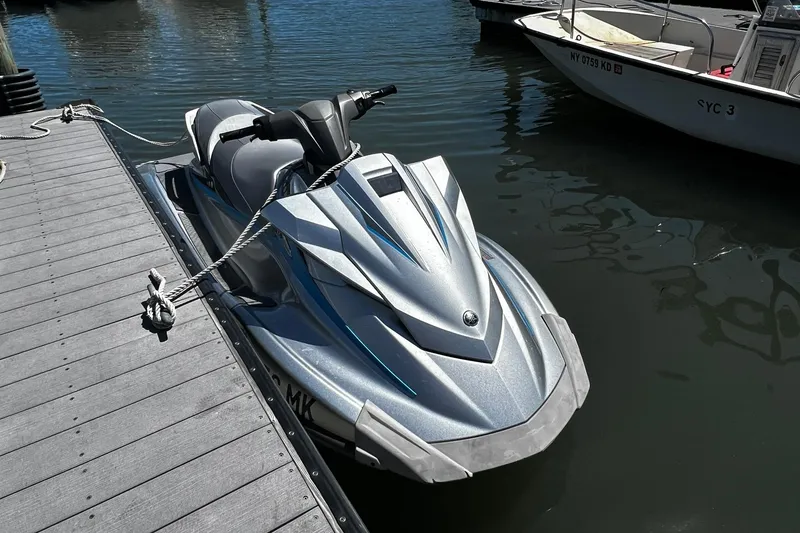 Slide: The Image of 2015 Yamaha WaveRunner VX Deluxe jet ski docked at marina. - 3