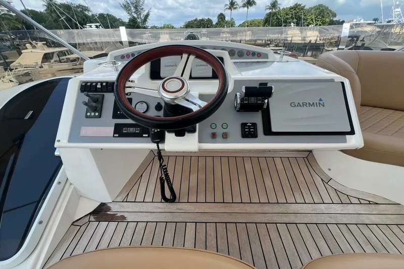 Slide: The Image of Helm of 2006 Princess 67 Flybridge yacht with Garmin navigation system and wooden steering wheel. - 10