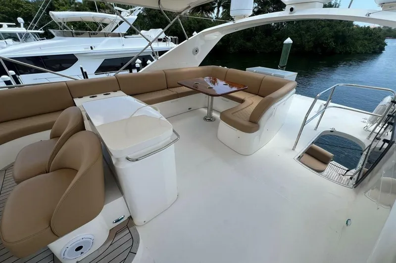 Slide: The Image of Luxurious 2006 Princess 67 Flybridge yacht with spacious seating and elegant design. - 12